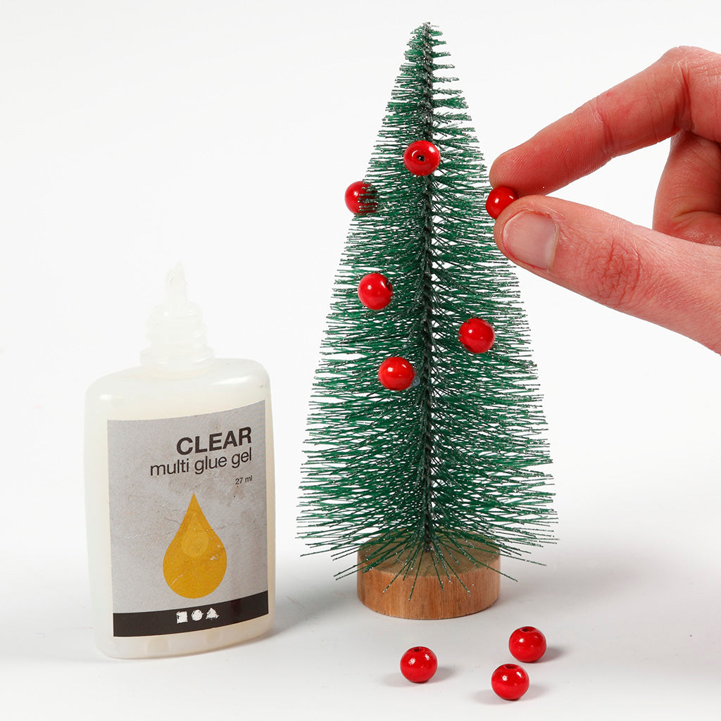 The Elf Decorating Santa's House